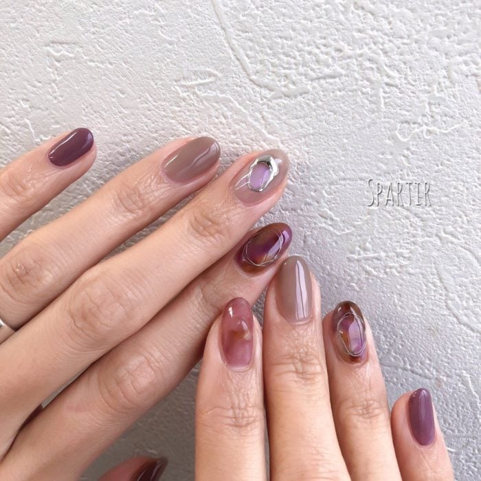 Manicure design in cherry, beige and pink tones